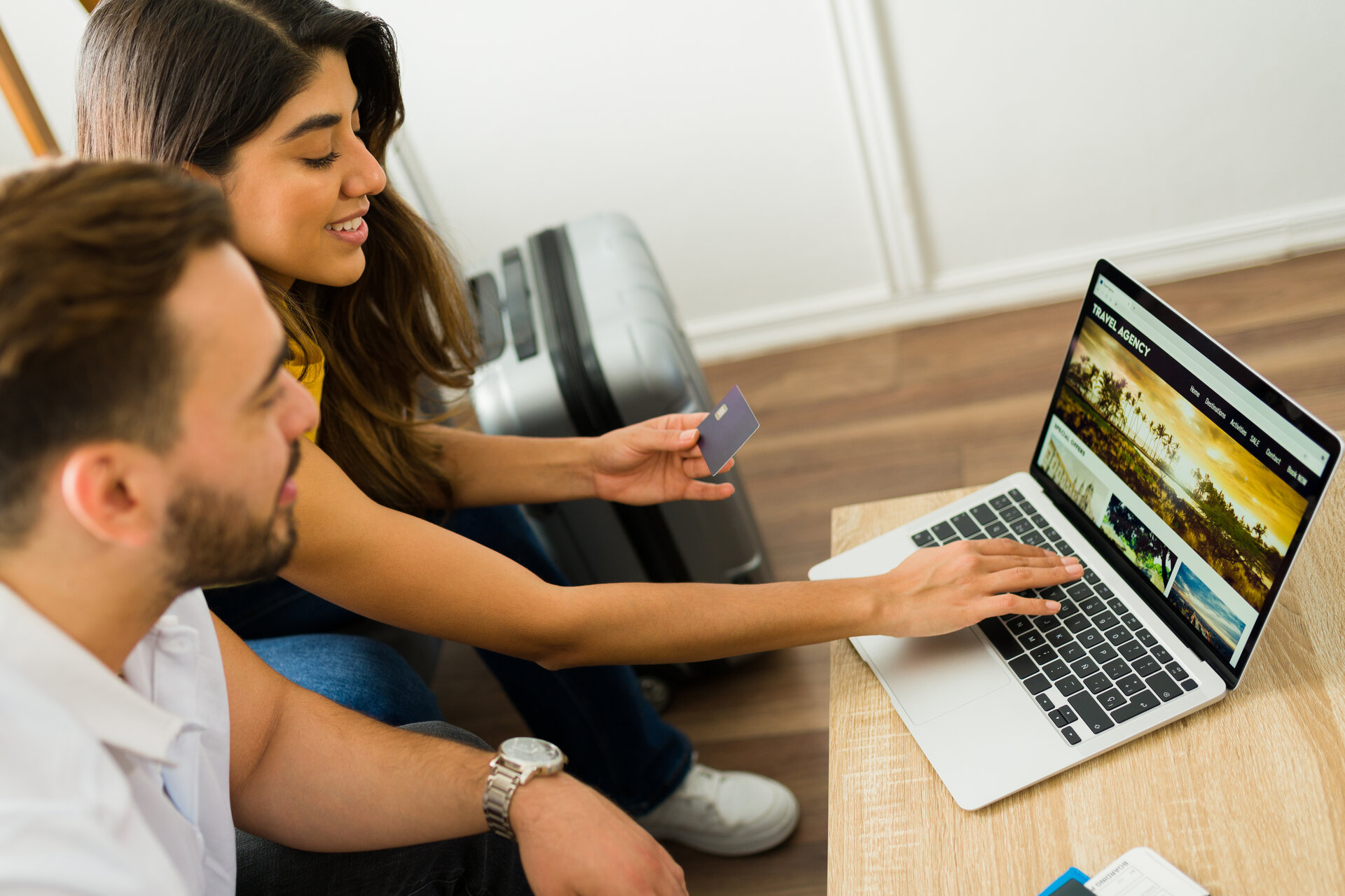 Beautiful couple booking online their beach vacations on ibiza